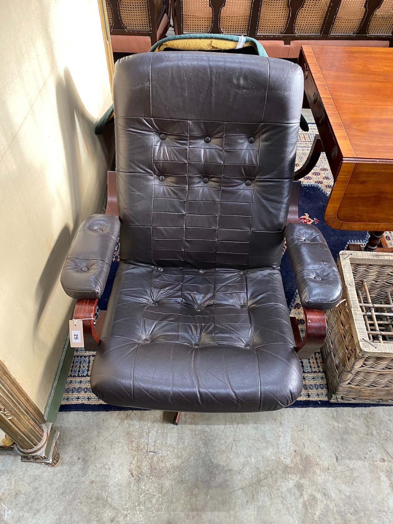 A mid century Scandinavian black leather swivel chair, width 77cm, depth 70cm, height 90cm